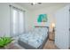 Cozy bedroom with a starfish patterned comforter and gray platform bed at 121 Palermo St, Davenport, FL 33897