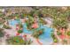 Resort-style pool area with multiple pools, a waterslide, and lounge chairs at 121 Palermo St, Davenport, FL 33897