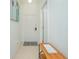 Bright entryway with tile floors, white door, and console table at 121 Palermo St, Davenport, FL 33897