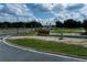 Entrance to new community featuring signage and landscaping at 1340 Lumpini St, Saint Cloud, FL 34771