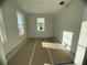 Spacious bedroom with large windows and light gray flooring at 1360 Lumpini St, St Cloud, FL 34771