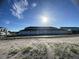 Row of garages with dark gray doors under a single roofline at 1360 Lumpini St, St Cloud, FL 34771