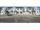 Row of new townhouses with gray and white exterior at 1360 Lumpini St, St Cloud, FL 34771