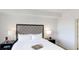 Spacious bedroom with a comfortable queen-size bed and plenty of natural light at 14501 Grove Resort Ave # 2122, Winter Garden, FL 34787
