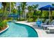 Lazy river pool with lounge chairs at 14501 Grove Resort Ave # 2122, Winter Garden, FL 34787