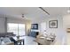 Spacious living area with balcony access and dining area at 14501 Grove Resort Ave # 2122, Winter Garden, FL 34787