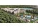 Aerial view of community with lake, pool, and building at 14501 Grove Resort Ave # 2122, Winter Garden, FL 34787