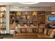 Relaxing lounge area with comfortable seating and a fully stocked bar at 14501 Grove Resort Ave # 2122, Winter Garden, FL 34787