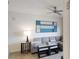Comfortable living room with gray sectional sofa and modern art at 14501 Grove Resort Ave # 2122, Winter Garden, FL 34787