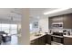 Modern kitchen with stainless steel appliances and white countertops at 14501 Grove Resort Ave # 2122, Winter Garden, FL 34787