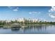 Community lakefront view with dock and building in background at 14501 Grove Resort Ave # 2122, Winter Garden, FL 34787