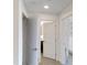 Bright hallway with doors leading to bedrooms and bathrooms at 14501 Grove Resort Ave # 2122, Winter Garden, FL 34787