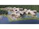 Aerial view of large community with lake and multiple buildings at 14501 Grove Resort Ave # 2122, Winter Garden, FL 34787