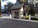 Gated community entrance with guardhouse at 14501 Grove Resort Ave # 2122, Winter Garden, FL 34787