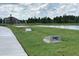 Community cornhole area next to pond at 15877 Tollington Aly, Winter Garden, FL 34787