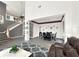 Open floor plan with a dining area and a stunning staircase at 2387 Laurel Blossom Cir, Ocoee, FL 34761