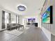 Open floor plan with living room, kitchen, and large TV at 2387 Laurel Blossom Cir, Ocoee, FL 34761