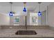 Kitchen sink with granite countertop and blue pendant lighting at 3012 Parkway Blvd # 102, Kissimmee, FL 34747