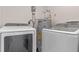 Laundry room with washer, dryer, and water heater at 3012 Parkway Blvd # 102, Kissimmee, FL 34747