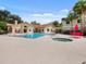 Community pool with hot tub and seating area at 3012 Parkway Blvd # 102, Kissimmee, FL 34747