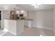 Modern kitchen with white cabinets, granite counters and breakfast bar at 3012 Parkway Blvd # 102, Kissimmee, FL 34747