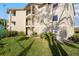Condo building exterior with landscaping at 3012 Parkway Blvd # 102, Kissimmee, FL 34747