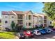 Two-story condo building with ample parking and landscaping at 3012 Parkway Blvd # 102, Kissimmee, FL 34747