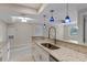 Updated kitchen with granite counters and stainless steel sink at 3012 Parkway Blvd # 102, Kissimmee, FL 34747