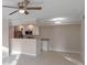 Bright living room with kitchen bar and updated flooring at 3012 Parkway Blvd # 102, Kissimmee, FL 34747