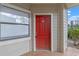 Red front door entry to condo unit 102 at 3012 Parkway Blvd # 102, Kissimmee, FL 34747