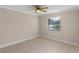 Bedroom with ceiling fan and window with blinds at 3012 Parkway Blvd # 102, Kissimmee, FL 34747
