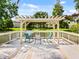 Relaxing community deck overlooking a pond at 3012 Parkway Blvd # 102, Kissimmee, FL 34747