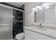 Bathroom with granite vanity and black tile shower at 3012 Parkway Blvd # 102, Kissimmee, FL 34747