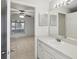 Bathroom with a vanity, sink, and view into bedroom at 359 Marquee Dr, Kissimmee, FL 34758