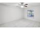 Bright bedroom with tile floors and a view of the screened-in patio at 359 Marquee Dr, Kissimmee, FL 34758