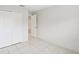 Simple bedroom with double door closet and tile floors at 359 Marquee Dr, Kissimmee, FL 34758