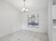 Simple dining area with tile floors and a window at 359 Marquee Dr, Kissimmee, FL 34758