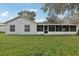 House exterior showcasing a large backyard at 359 Marquee Dr, Kissimmee, FL 34758