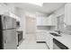 Modern kitchen featuring stainless steel appliances and white cabinets at 359 Marquee Dr, Kissimmee, FL 34758