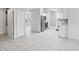 Open concept living area with tile floors and kitchen access at 359 Marquee Dr, Kissimmee, FL 34758