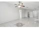Spacious living room featuring tile floors and a ceiling fan at 359 Marquee Dr, Kissimmee, FL 34758