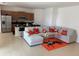 Open living area with sectional sofa and kitchen at 5231 Maddie Dr, Haines City, FL 33844