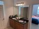 Double vanity bathroom with granite countertop at 5231 Maddie Dr, Haines City, FL 33844