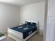 Well-lit bedroom with double bed and en-suite access at 5231 Maddie Dr, Haines City, FL 33844