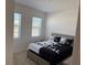 Bedroom with a double bed and two windows at 5231 Maddie Dr, Haines City, FL 33844