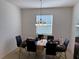 Dining room with table, chairs, and chandelier at 5231 Maddie Dr, Haines City, FL 33844