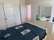 Bedroom with double bed, dresser and access to the bathroom at 5231 Maddie Dr, Haines City, FL 33844