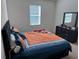 Bright bedroom with a queen bed, dresser, and window coverings at 5231 Maddie Dr, Haines City, FL 33844