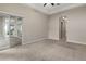 Main bedroom with plush carpeting and access to a private patio at 7014 Phillips Cove Ct # 27, Orlando, FL 32819