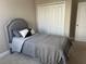 Cozy bedroom with a twin-sized bed and built-in closet at 14739 Glade Hill Park Way, Winter Garden, FL 34787